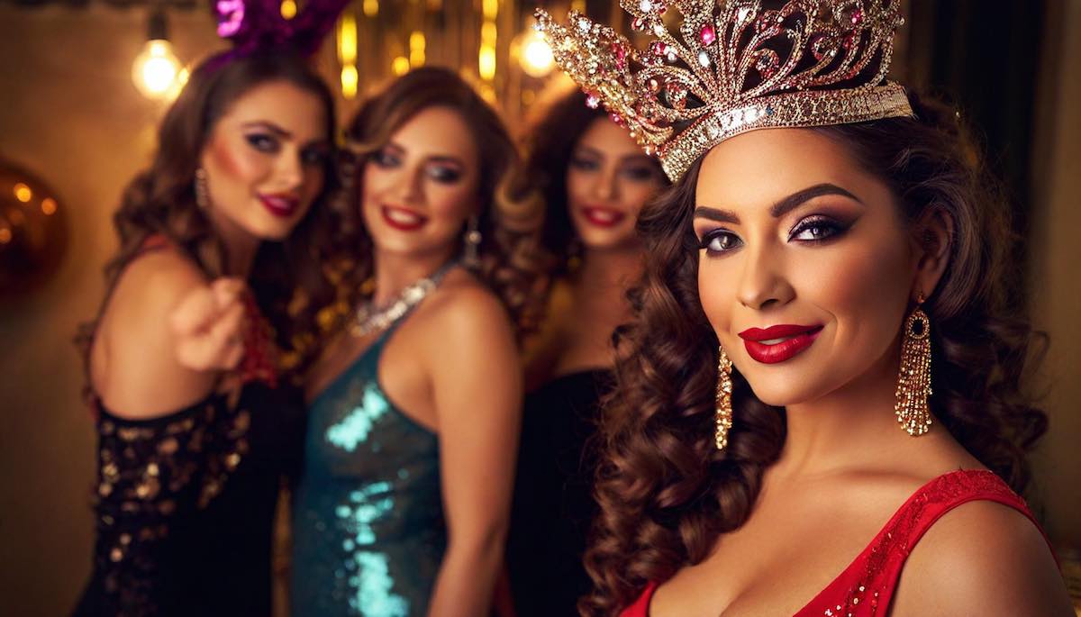 The bachelorette wearing a burlesque crown and flashy earings